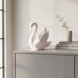 White low poly swan sculpture with angular geometric form, close-up detail