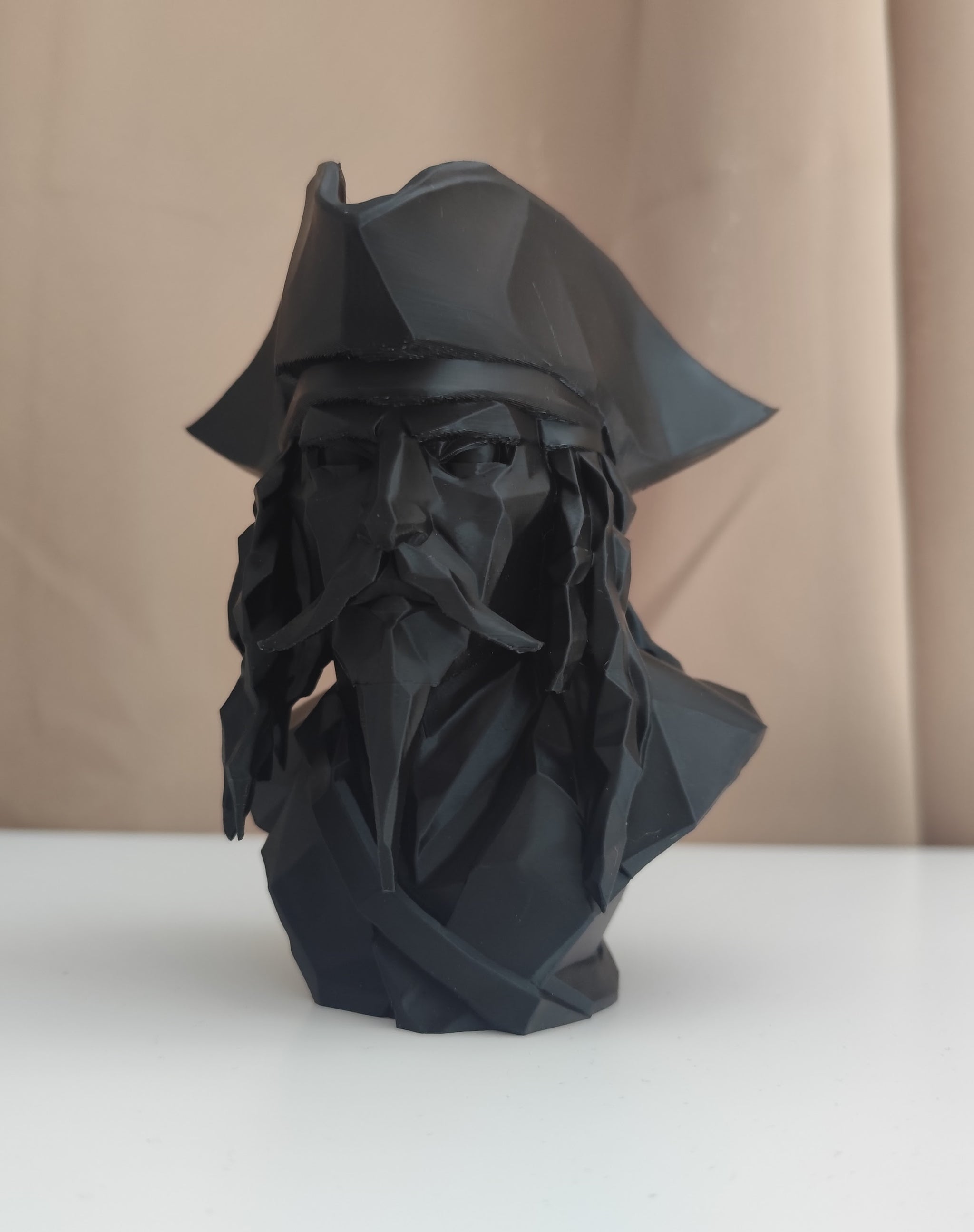 Close-up of low poly pirate bust showing geometric faceted surface detail