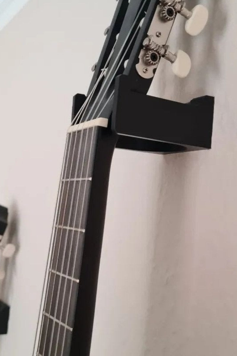 Minimalist guitar wall mount in profile, showing clean geometric support structure
