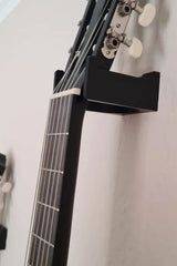 Minimalist guitar wall mount in profile, showing clean geometric support structure