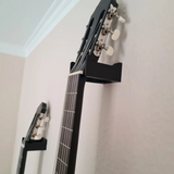 Close detail of guitar wall mount contact point with refined edge finish