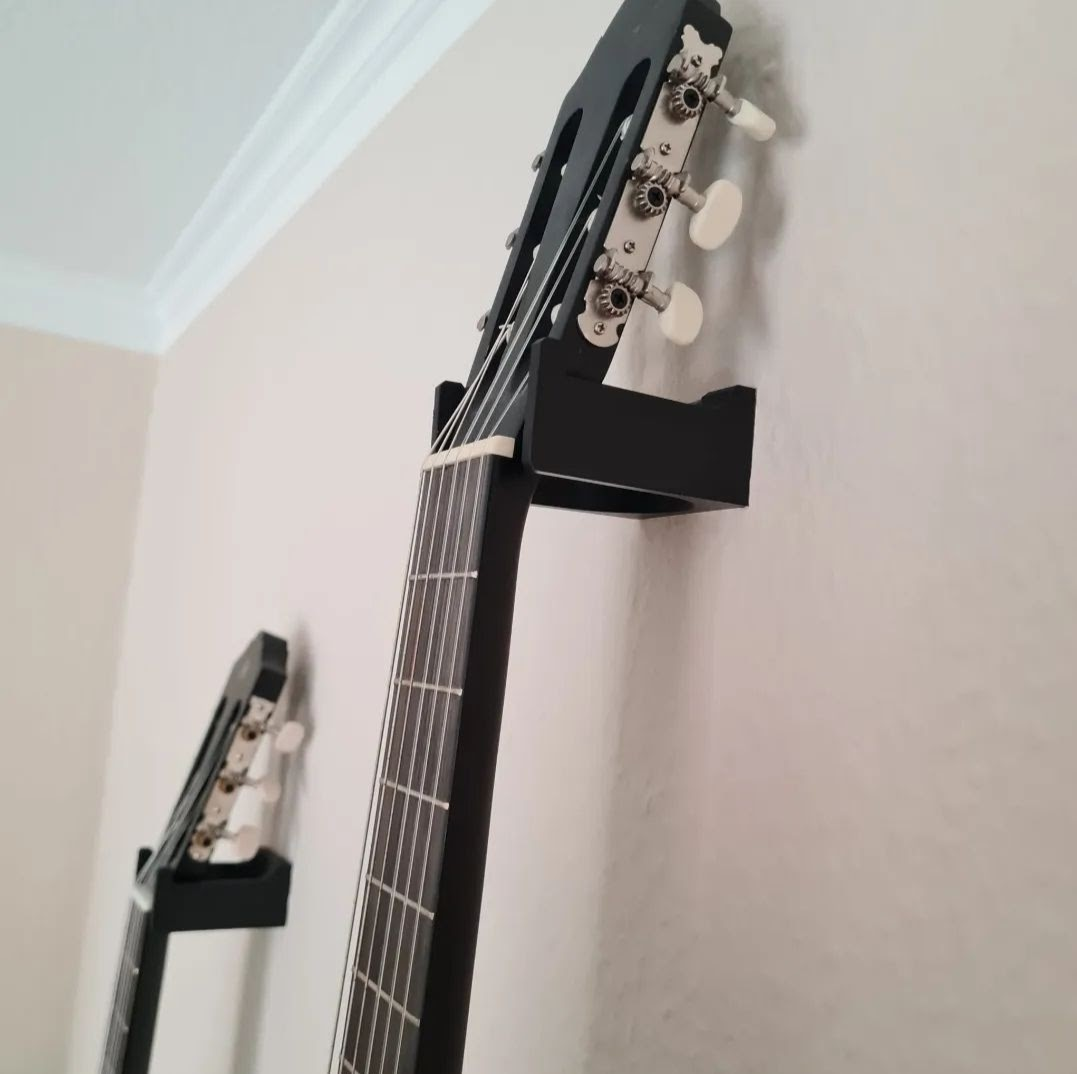Close detail of guitar wall mount contact point with refined edge finish