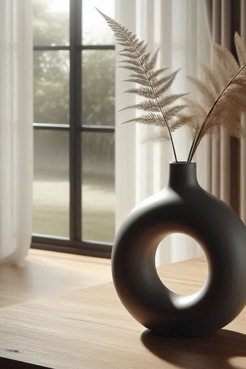 White circular hollow vase with clean Nordic lines, close-up front view