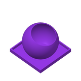 Close-up of The Ball remote control holder showing its rounded form and interior cavity