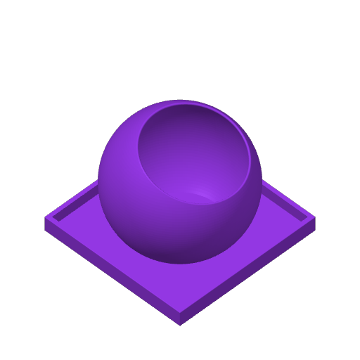 Close-up of The Ball remote control holder showing its rounded form and interior cavity