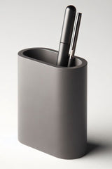 Close-up of minimalist pencil holder with vertical ridged texture