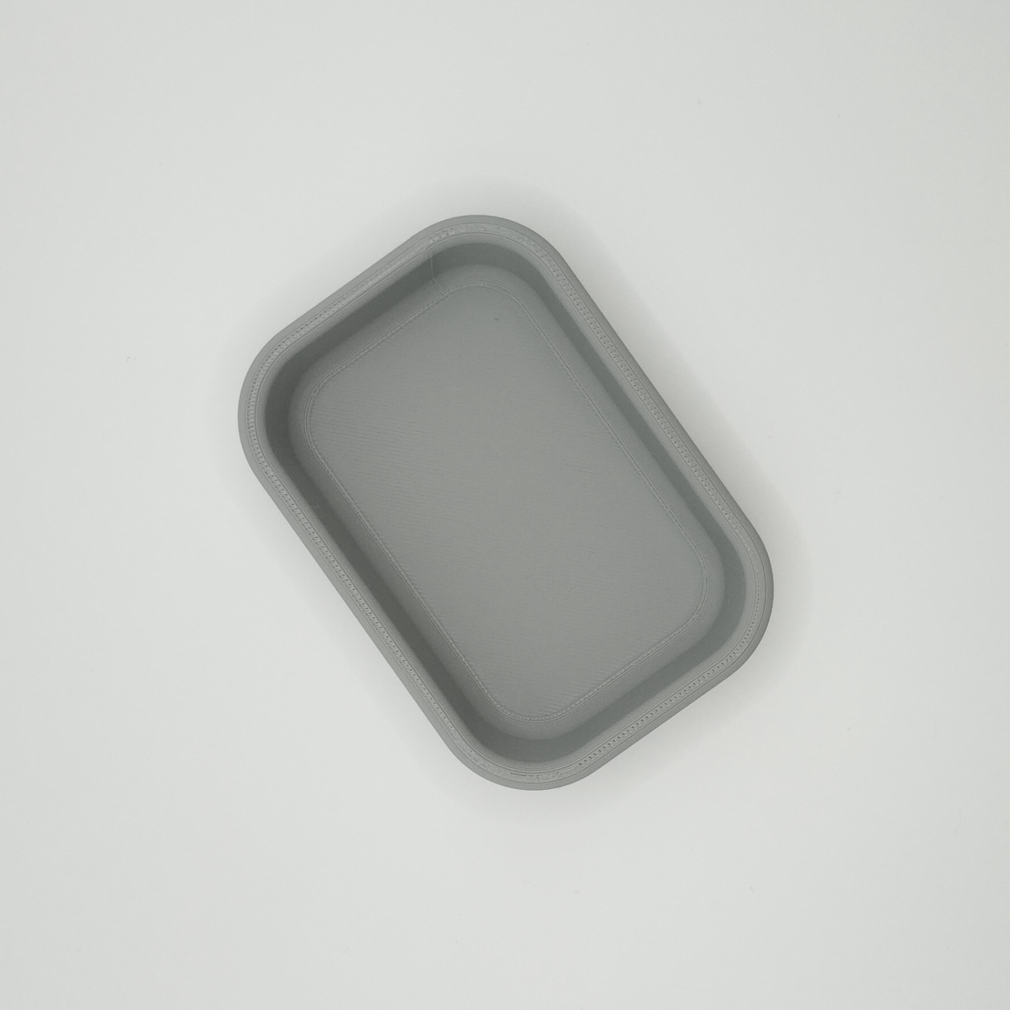 Detail of key tray's clean edge and shallow bowl form