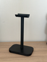 Minimalist headphone stand with clean curved arm and compact base