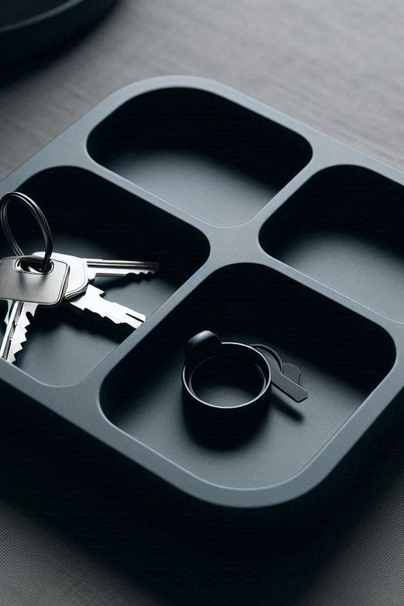 Quadruple key tray with four divided compartments, close-up view