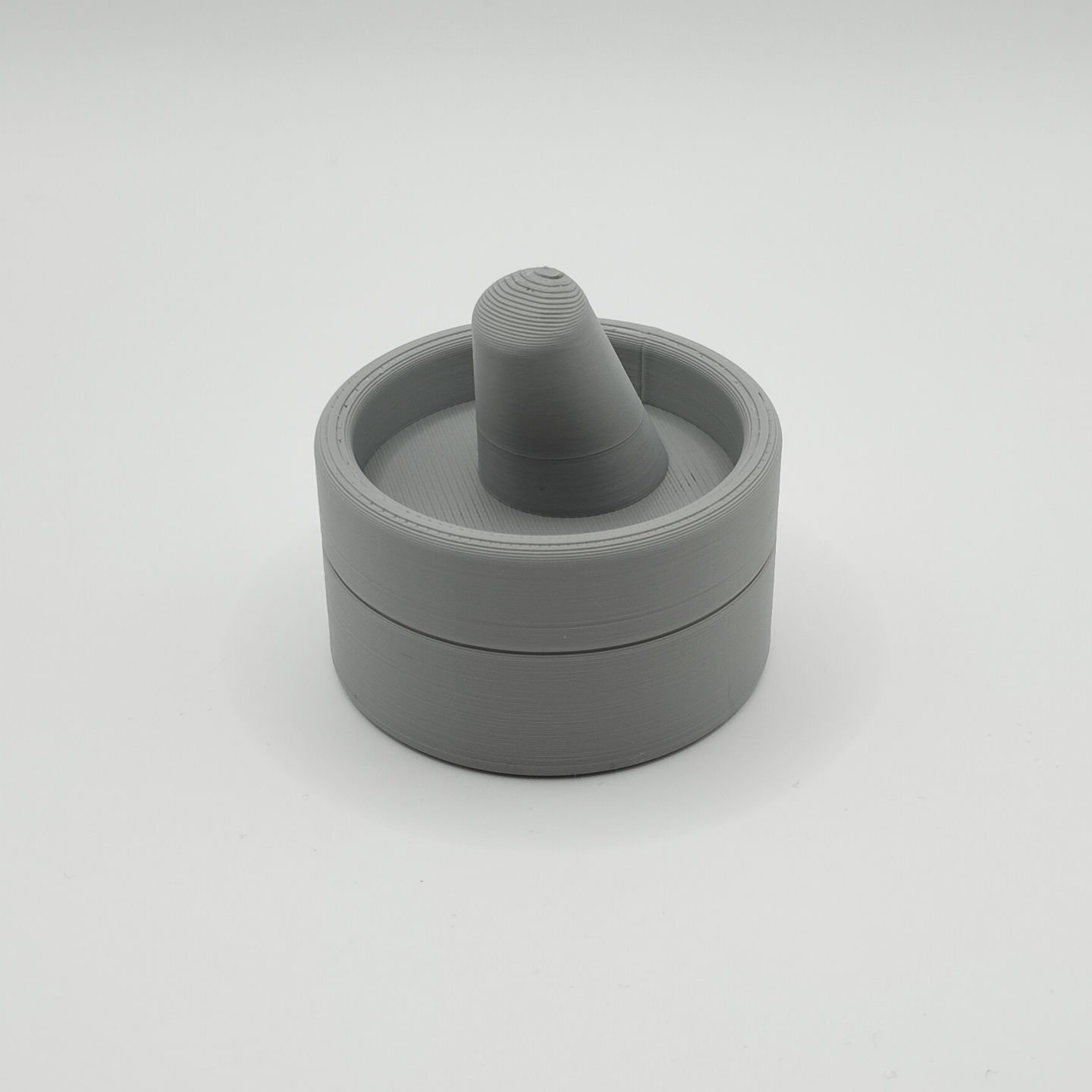 Ring holder displayed on a dresser with jewelry and home accessories
