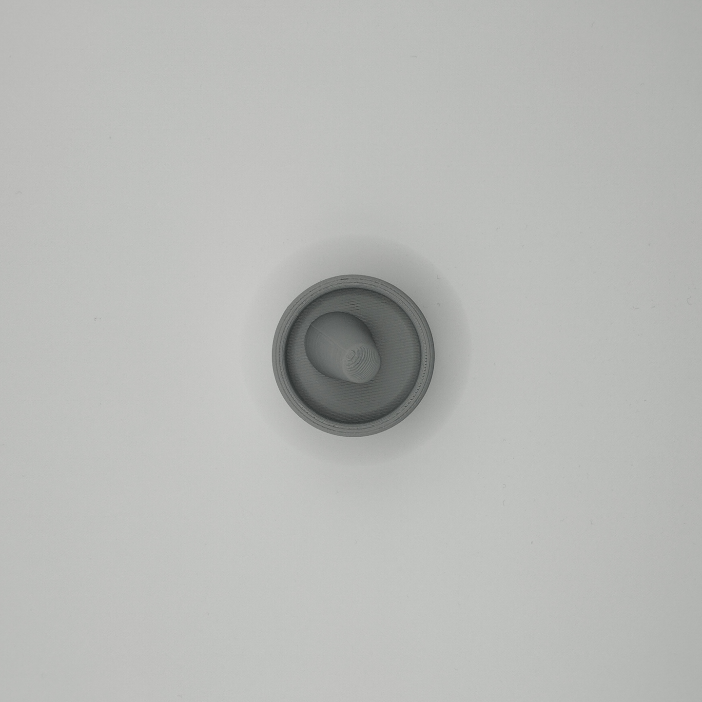 Close-up of ring holder surface showing refined sculptural detail