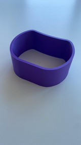 Curved necklace holder with delicate chain draped across its surface