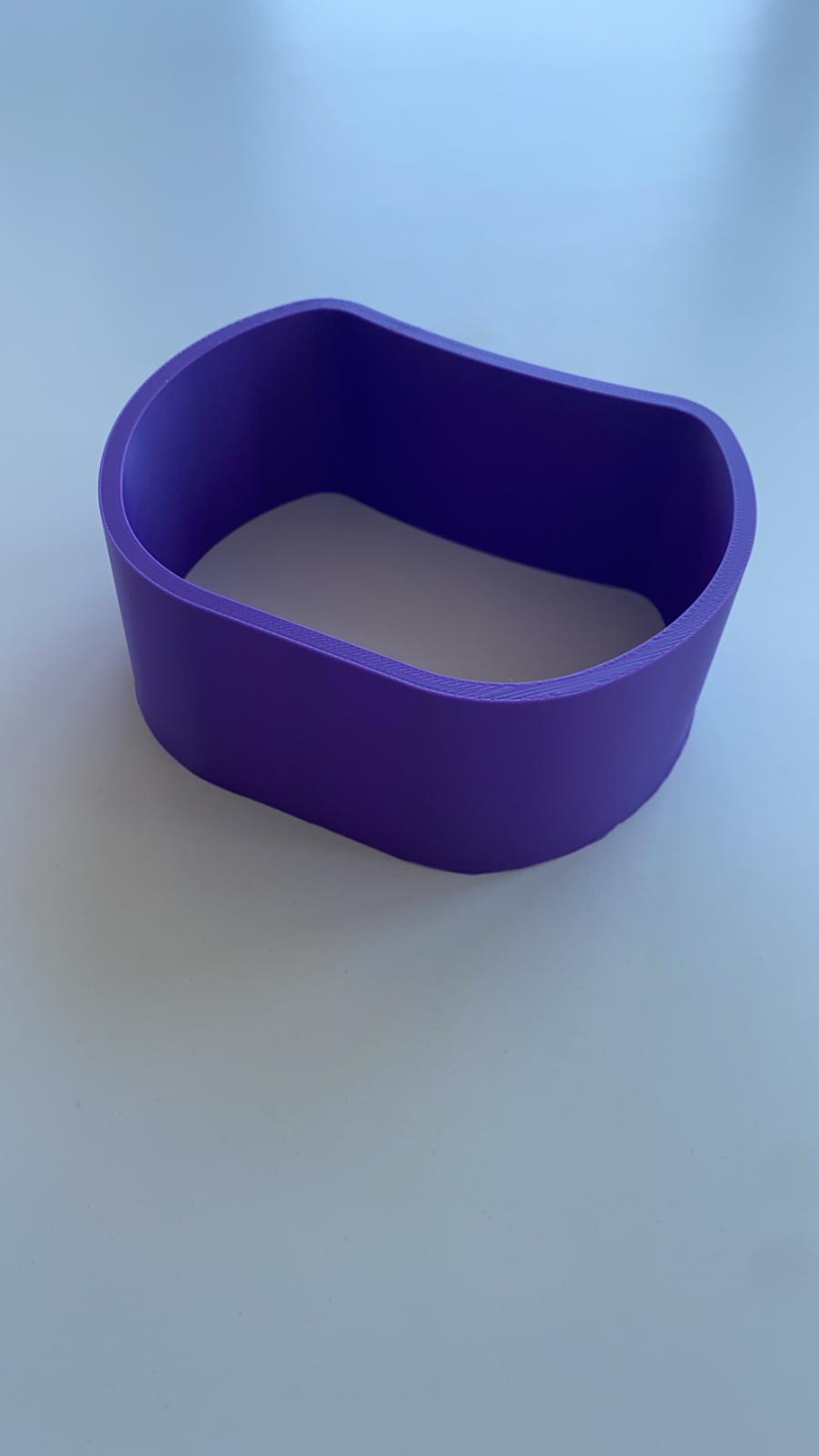Curved necklace holder with delicate chain draped across its surface