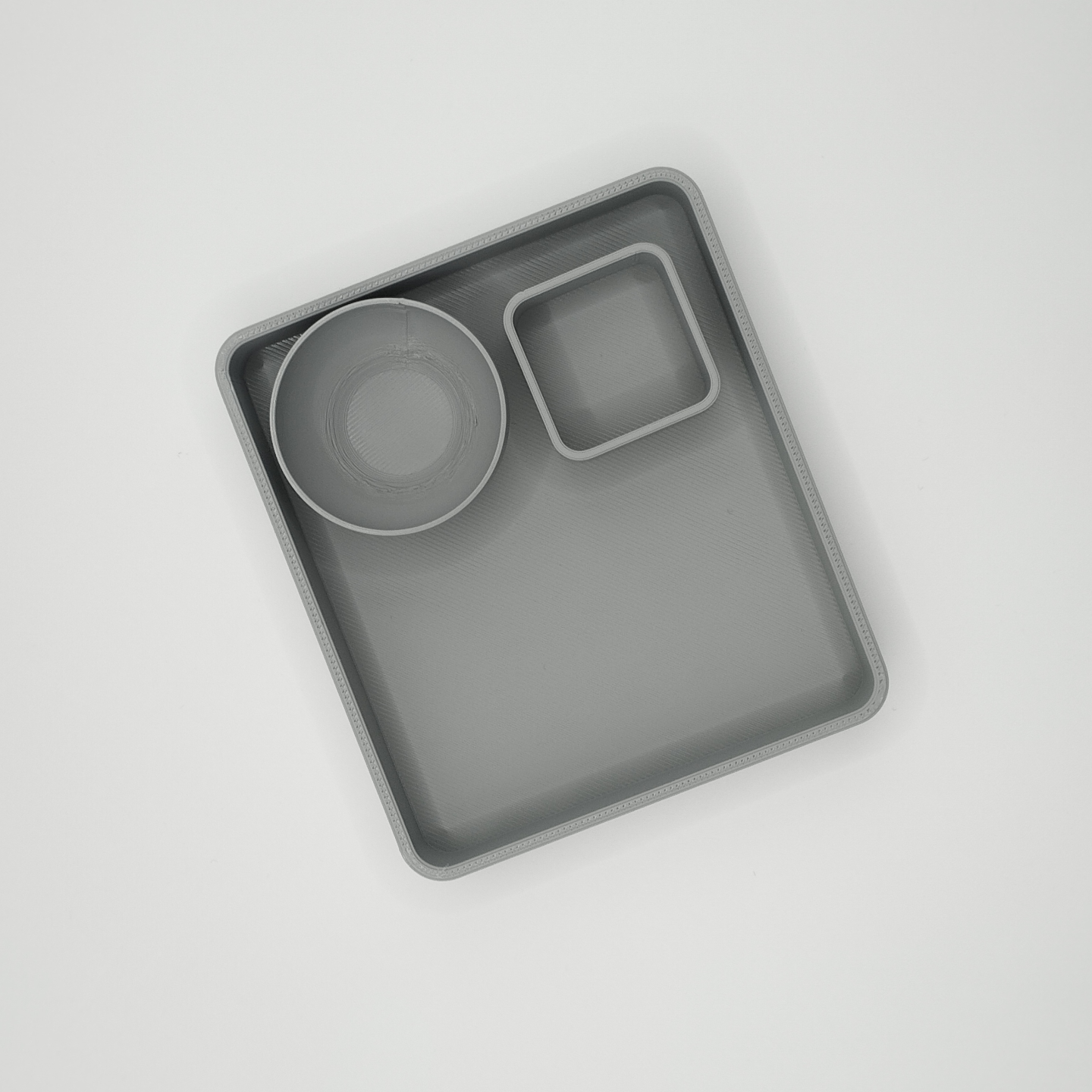 Close detail of smooth bowl surface of modern remote caddy