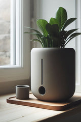 Minimalist round self-watering plant pot with integrated water chamber, close-up view