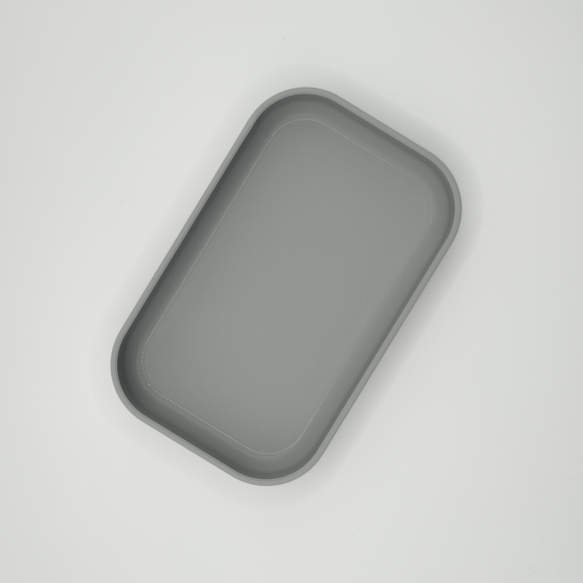 Close-up detail of curved edge and smooth finish on the key tray