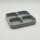 Quadruple key tray styled on a light wood shelf with keys inside