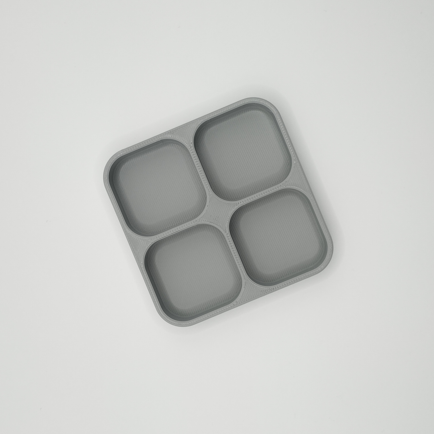Close-up detail of the thin-walled compartment dividers of the key tray