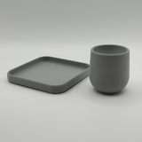 Egg cup with coaster on pale table setting, Scandinavian breakfast