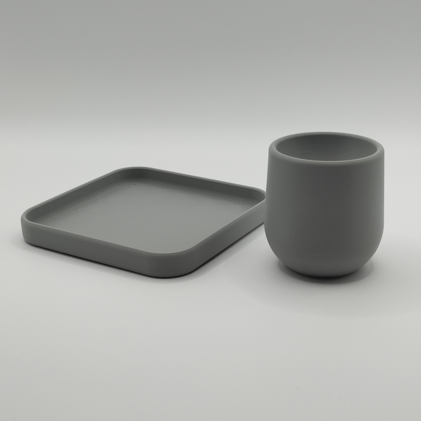 Egg cup with coaster on pale table setting, Scandinavian breakfast