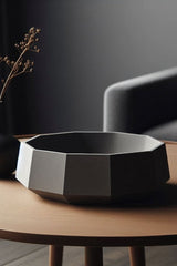 Close-up of a minimalist bowl with sharp geometric lines and smooth surface