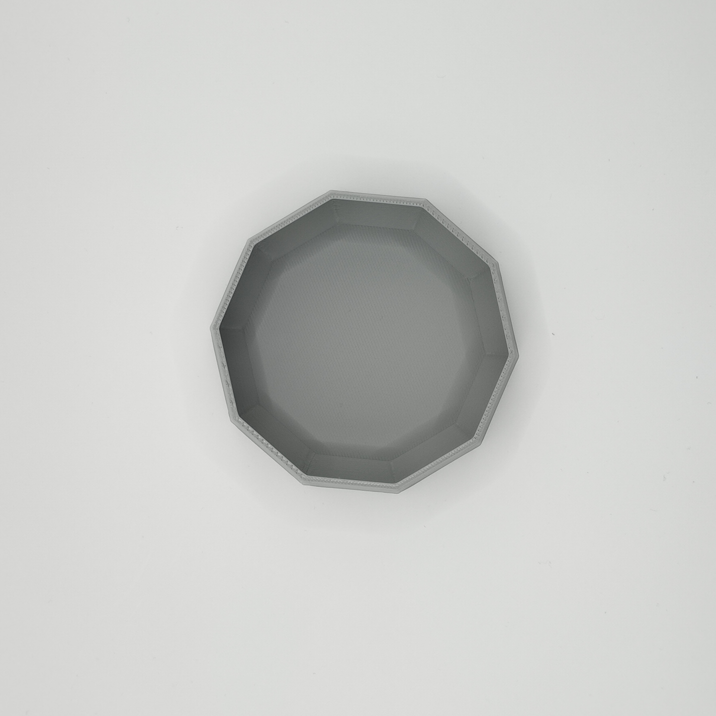 Detail of the sharp, clean edge and refined surface texture of the bowl