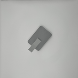 Detail of headphone stand's angular support structure and neutral finish