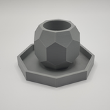 Octagonal candle holder with coaster on white wooden table