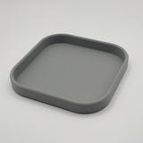 Close-up detail of the square key and phone tray's crisp edge and smooth finish