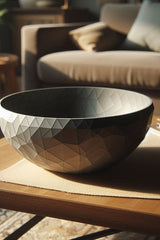 Close-up of low poly bowl showing geometric facets and light-catching triangular surface