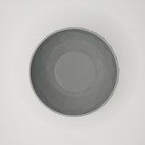 Detail of the sculptural faceted texture on the low poly bowl surface