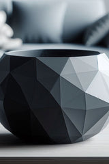 Close-up of low poly bowl showing cracked stone-inspired geometric facets and subtle shadow play