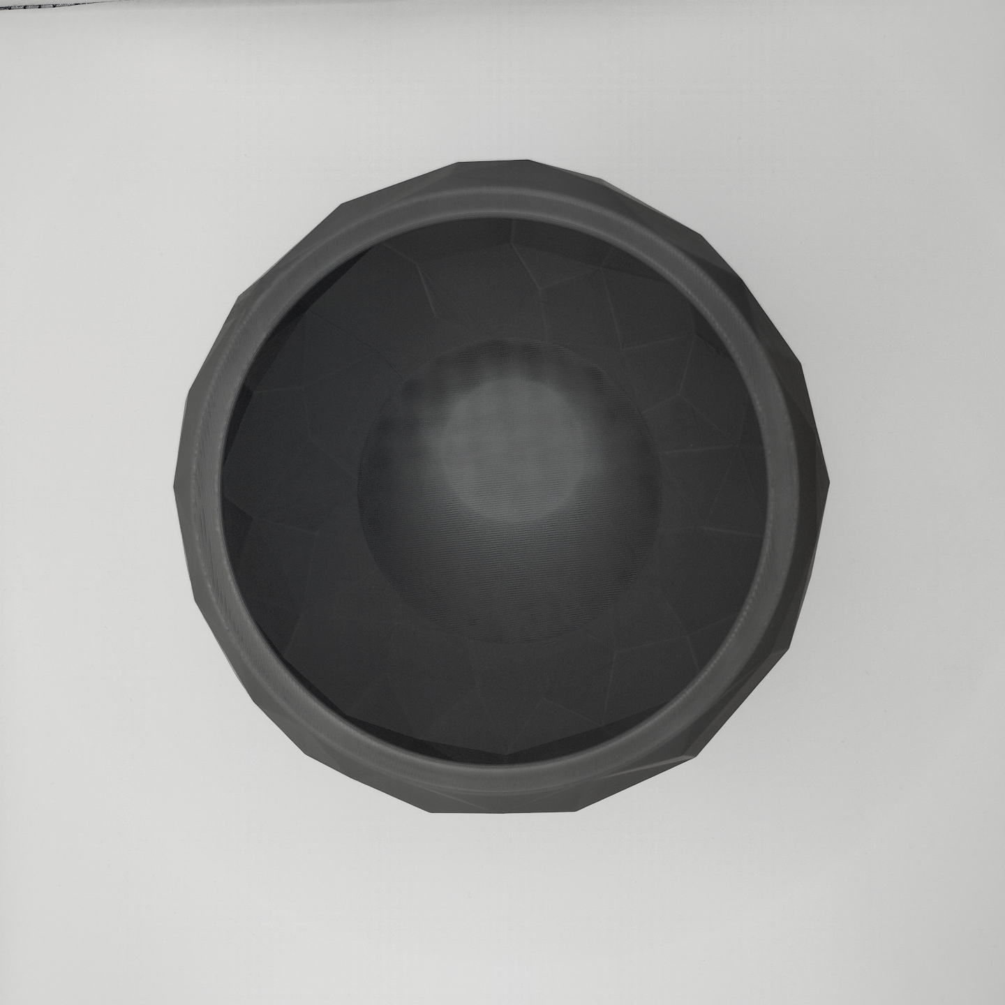 Detail of angular faceted surface texture on cracked stone-design low poly bowl