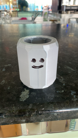 White toothbrush holder for kids with soft rounded edges, holding a small toothbrush