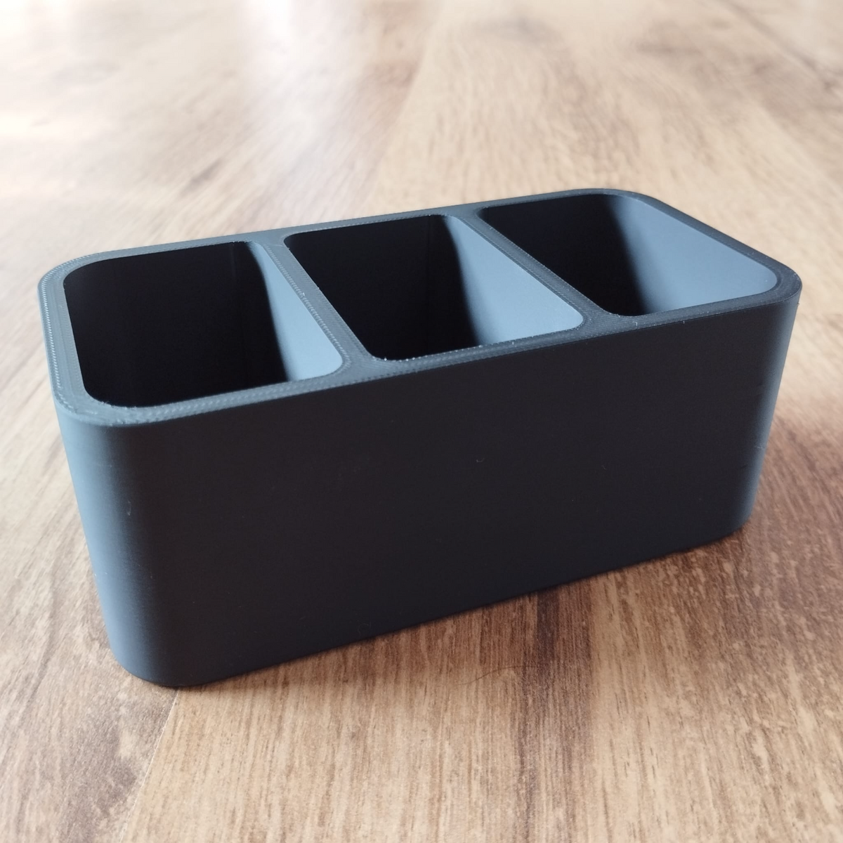 Minimalist remote control holder, clean lines and open design