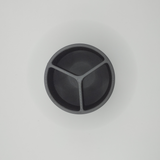 Close detail of the smooth surface and open rim of the minimalist brush container