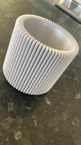Close-up of ribbed pencil holder showing flat vertical texture and minimalist design