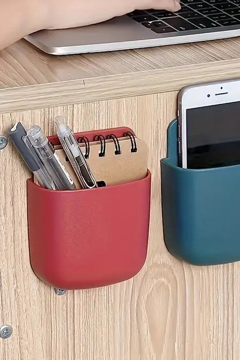White wall-mounted phone holder with cable entry shown close-up