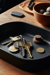 Overhead view of oval catch-all tray in natural light, showing its clean edges and curved form