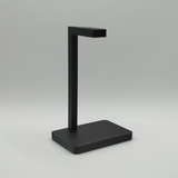 Minimalist headphone stand holding gaming headset on modern office desk
