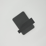 Detail view of headphone stand's smooth support structure and subtle texture