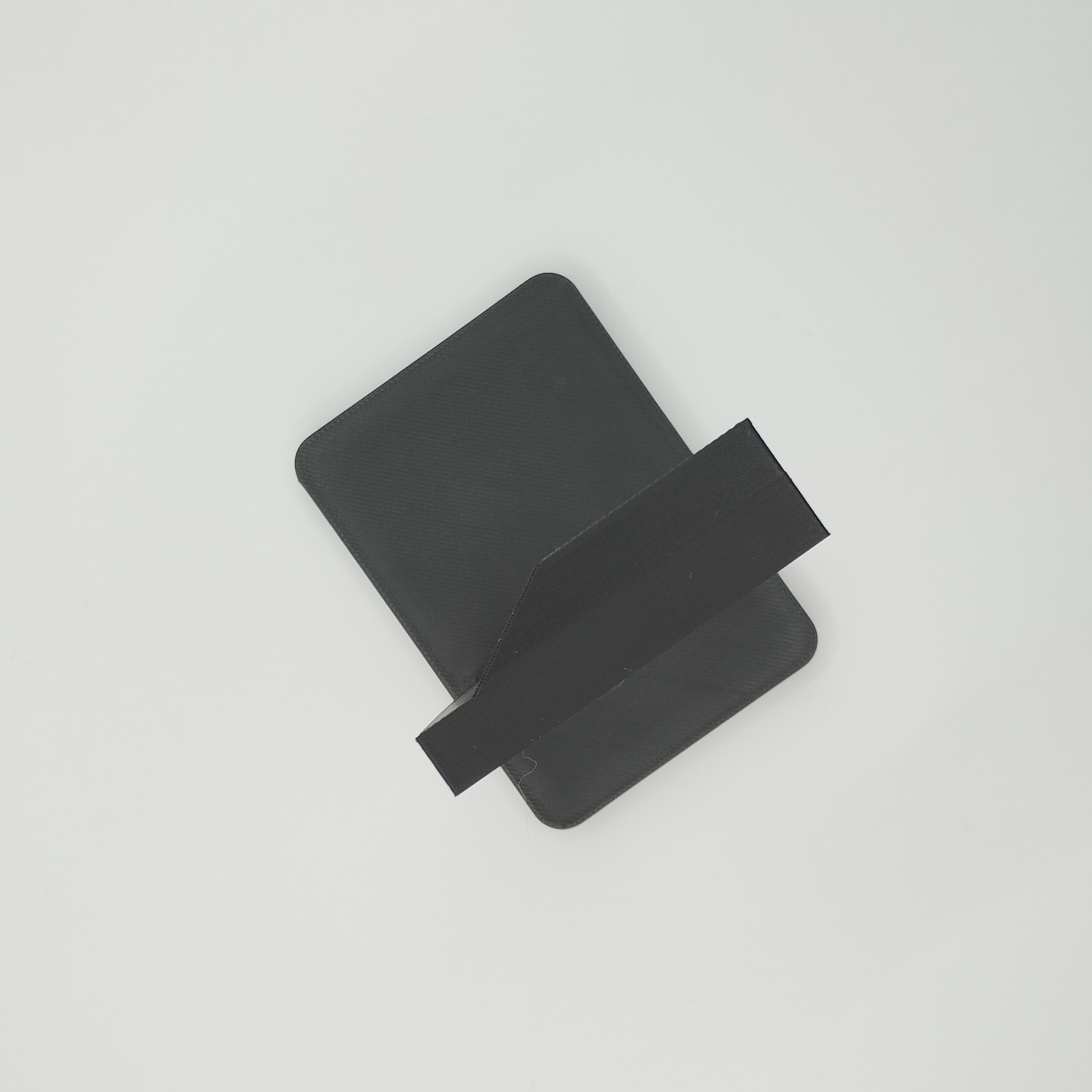 Detail view of headphone stand's smooth support structure and subtle texture