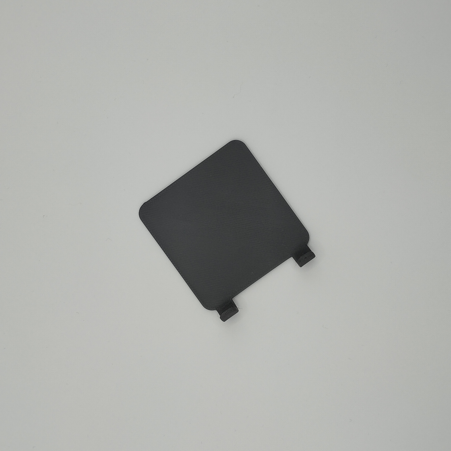 Detail of razor holder's refined edge and subtle surface texture