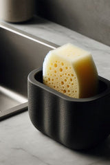 Fuzzy textured sponge holder with soft matte finish, pale neutral tone
