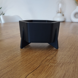 Hexagonal planter with geometric six-sided form, close-up view