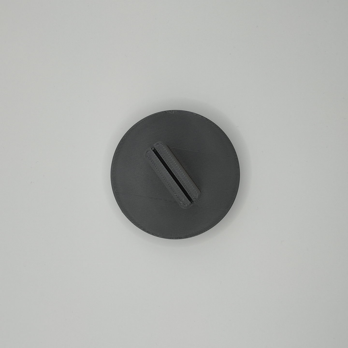 Close-up of the card holder's clean triangular edge and surface