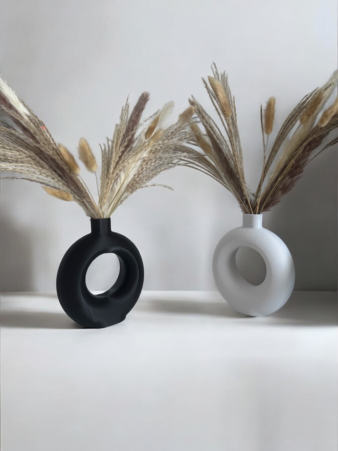 Detail of the sculptural curve and clean line of the ring vase profile