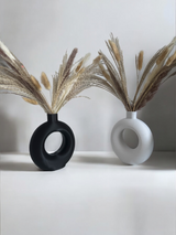 Detail of the sculptural curve and clean line of the ring vase profile