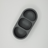 Detail of smooth curved surface and soft contours on rounded remote holder
