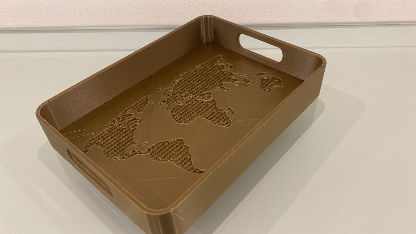 OneWorld designer tray with embossed world map continents, pale grey finish